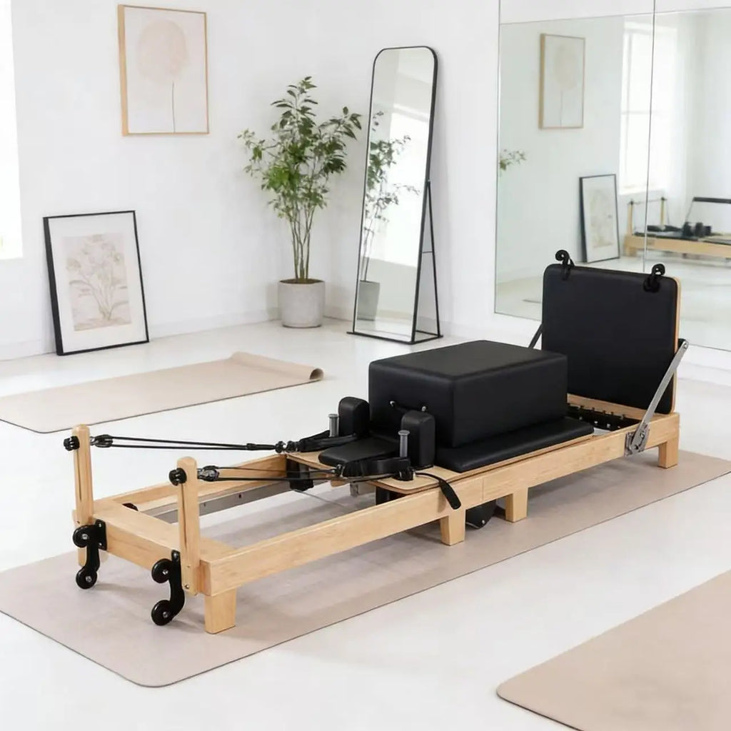 Reformer Pilates pliable en érable, sellerie noire